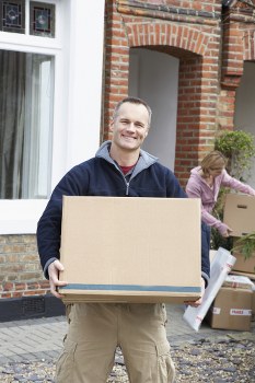 Person arranging boxes in a Bermondsey storage space