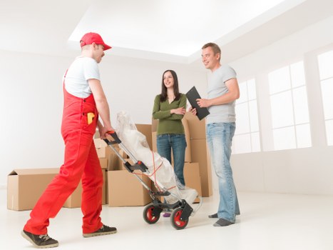 Professional movers handling furniture during a Bermondsey move